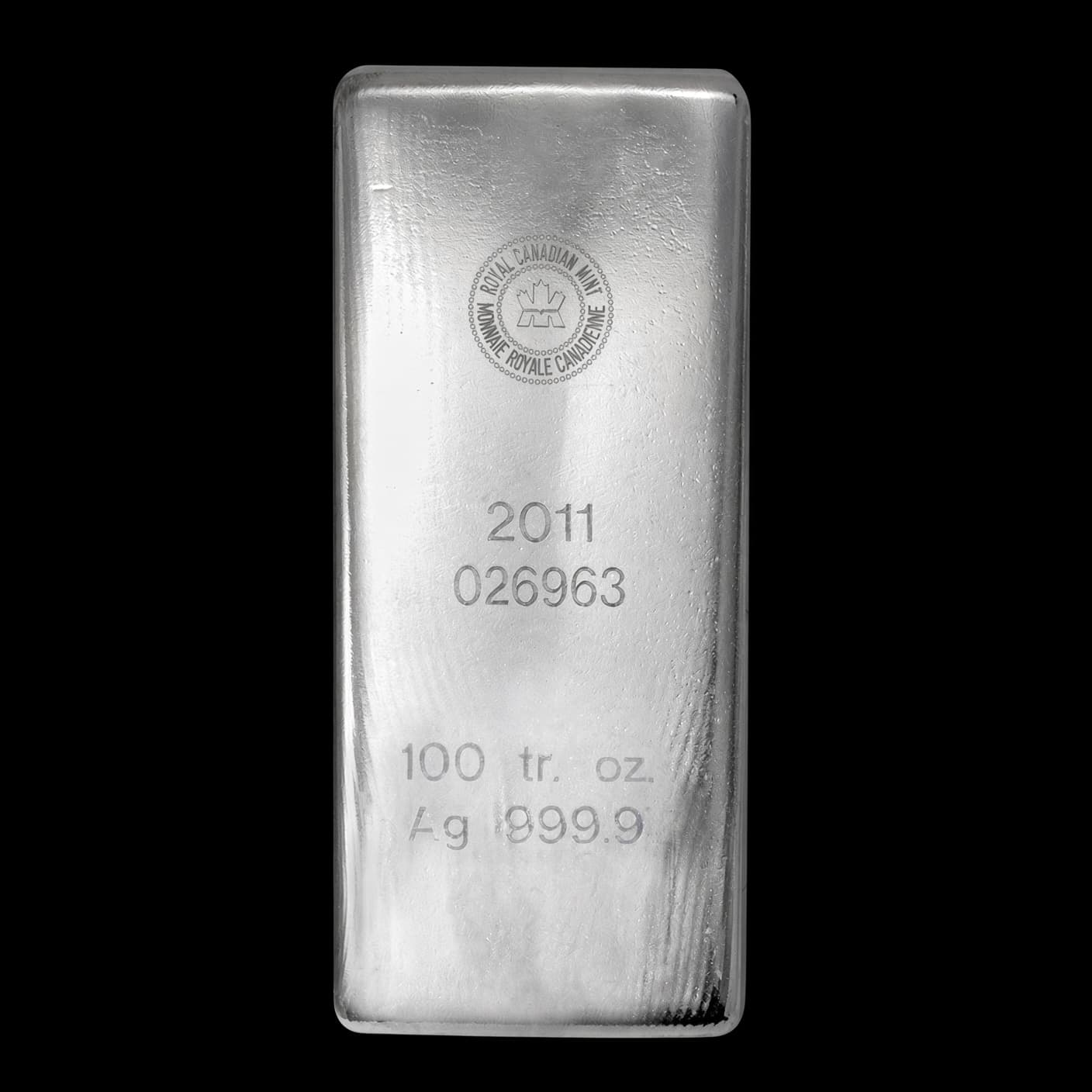 100 oz Royal Canadian Mint silver bar stamped with the RCM roundel, serial number, 100 tr. oz. and Ag 999.9