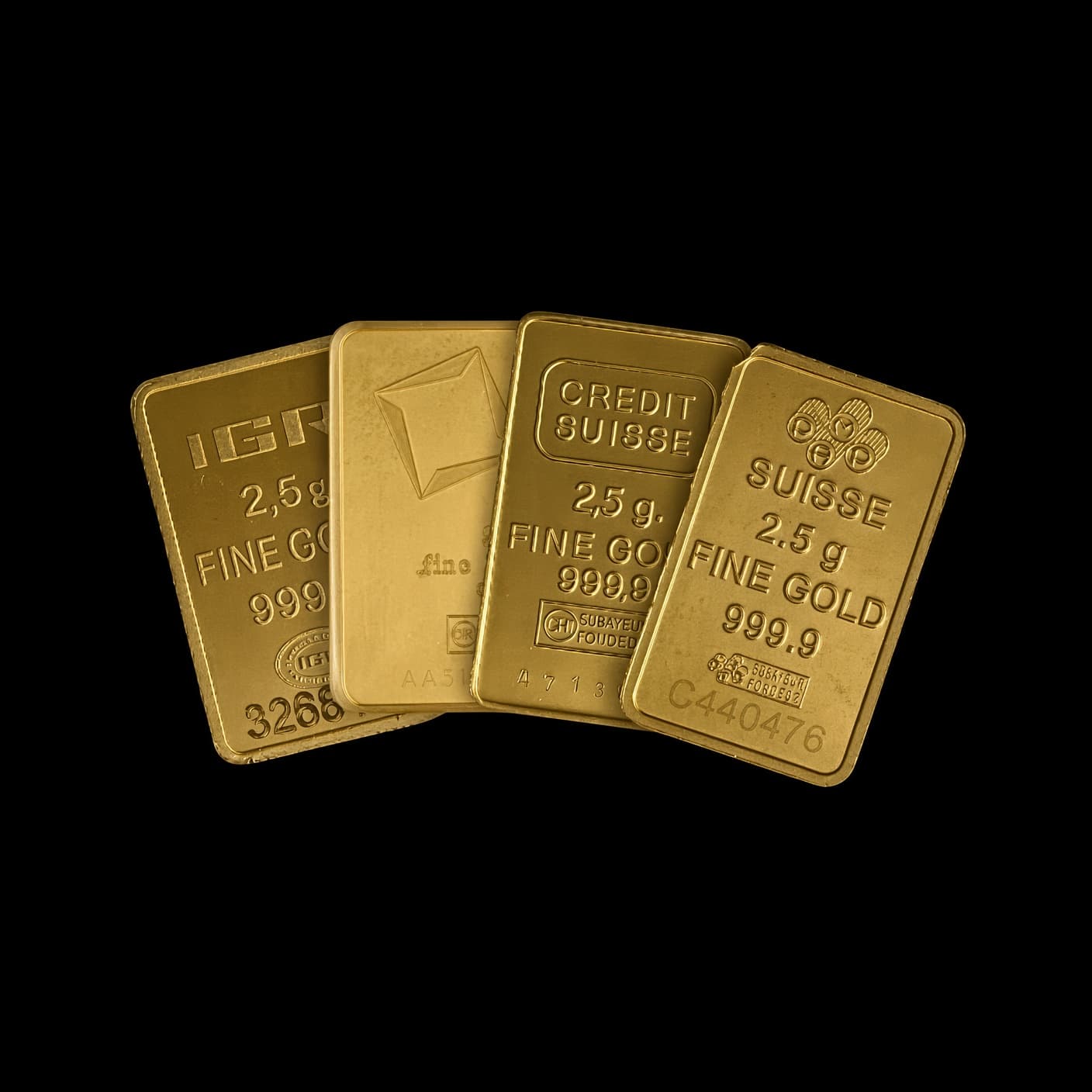 Assorted 2.5 gram secondary-market gold bars from IGR, Credit Suisse, and PAMP Suisse, each stamped 999.9 fine gold