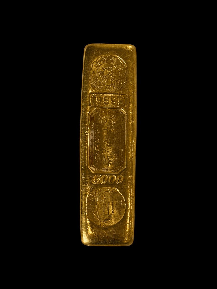 King Fook 5 tael gold finger bar front stamped 9999 and 5000 with Chinese characters and dealer chop marks