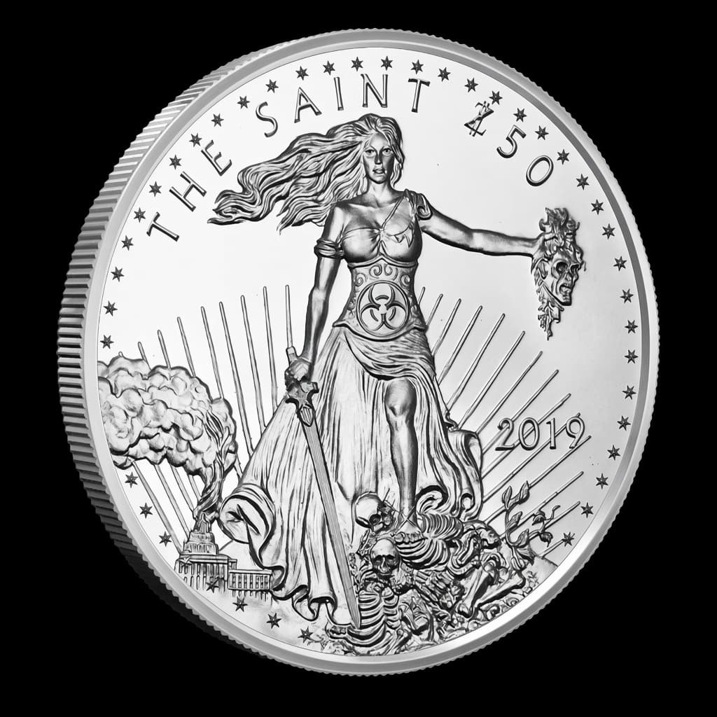 1 oz Zombucks The Saint silver round showing Liberty holding a sword and severed zombie head above a field of skeletons with the Capitol behind, legend THE SAINT 2019